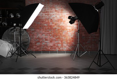 Empty photo studio with lighting equipment