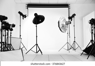 Empty Photo Studio With Lighting Equipment