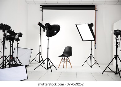 Empty Photo Studio With Lighting Equipment