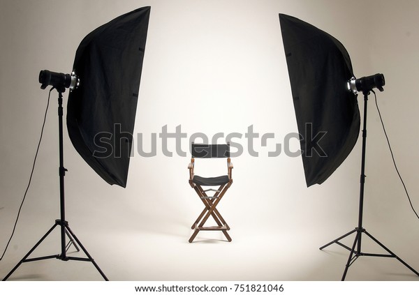 Empty photo studio with lighting equipment.\
Space for text. Vacant chair. The concept of selection and casting.\
Screensaver for your\
desktop.