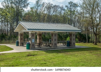 Empty picnic pavilion in a park is closed due to the Coronavirus stay at home order in the public parks on a sunny day in early springtime