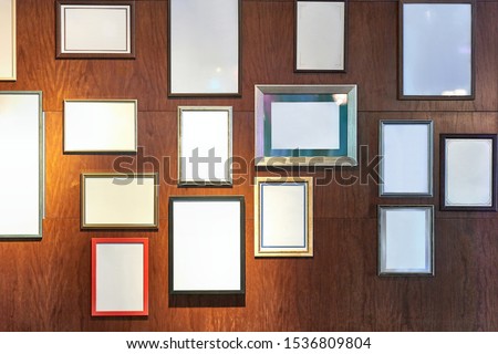 Empty picture frames on a wall for displaying certificates, award, accomplishments, pieces of art, copy space