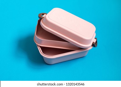 Empty Pink Bento Lunch Box On Blue Background