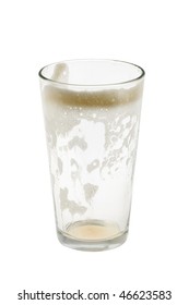 Empty Pint Glass With Foam On White Background