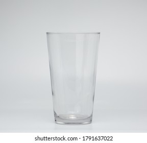 Empty Pint Glass On White Background