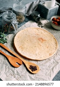 Empty Pizza Base On Wooden Board. Process Of Making Homemade Pizza