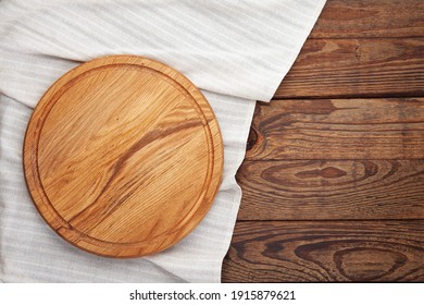 Empty Pizza Board And White Tablecloth On Wooden Deck