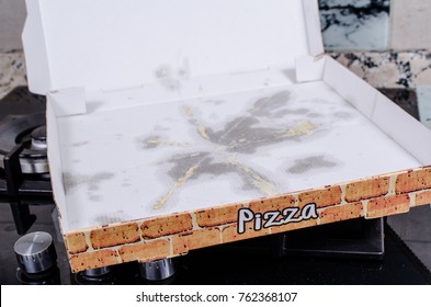 Empty Pizza Box With Grease Stains, A  Fast Food Concept