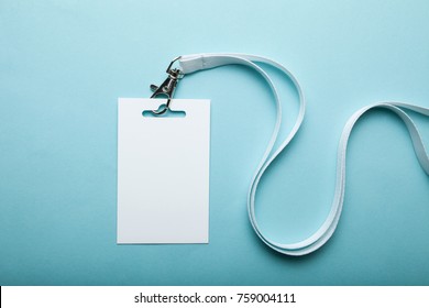 Empty plain name tag mock up, on blue background. Business blank badge. - Shutterstock ID 759004111