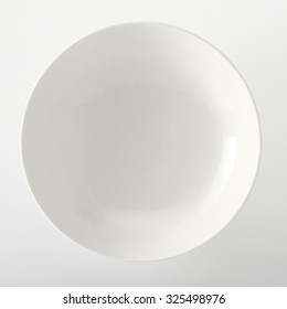 Empty Plain White Generic Bowl Viewed Close Up Overhead With Space For Placement Of Food On A White Background