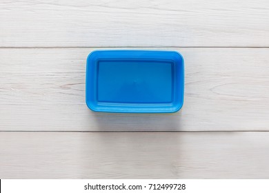 Empty Plastic Lunch Box On White Wood, Top View. Blue Container, Copy Space