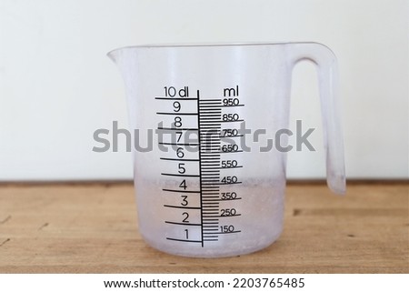 empty plastic measuring jug with handle