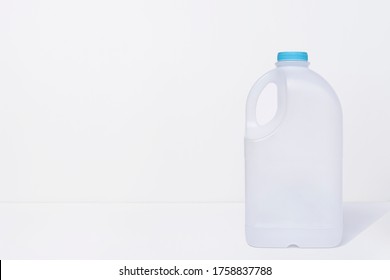 Empty Plastic Milk Gallon Container On White Background With Copy Space