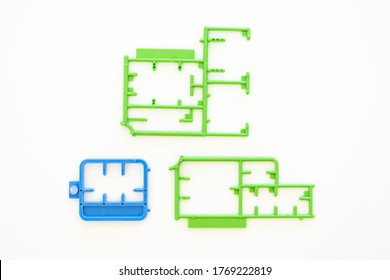 Empty Plastic Sprue Or Model Kit Assembly Toy Injection Molding Set After Cut Part On White Background