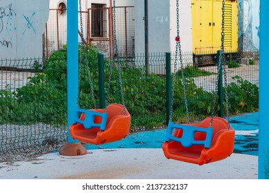 Empty Plastic Swing In Children's Park. No People In Photo.