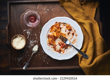 Empty Plate After Eating Bolognese Pasta With Parmesan Cheese And Empty Glass Of Red Wine. Finished Dirty Plates After Pasta Dinner. Finished Bolognese Sauce Pasta.