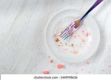 Empty Plate Of Birthday Cake Crumbs With Fork Flat Lay