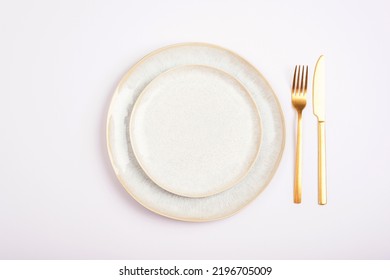 Empty Plate With Fork And Knife On White Background. Table Setting. Top View, Flat Lay.