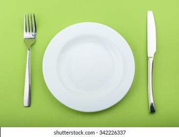 Empty Plate Fork Knife On Green Stock Photo (Edit Now) 113847553