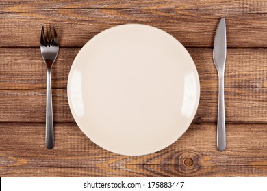 Empty Plate On A Wooden Table