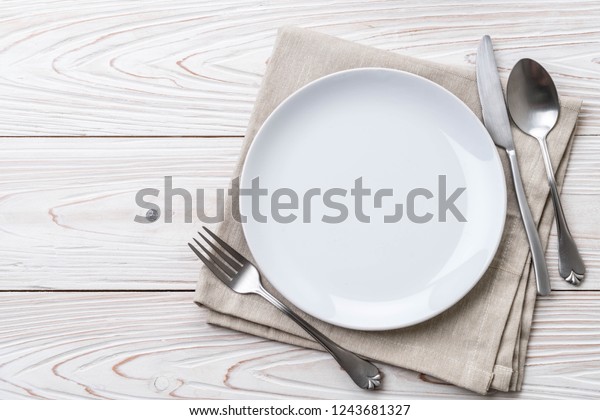 Empty Plate Spoon Fork Knife On Stock Photo (Edit Now) 1243681327
