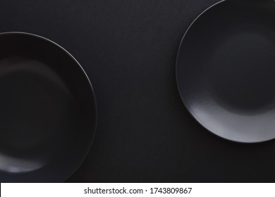 Empty Plates On Black Background Premium Stock Photo 1743809867