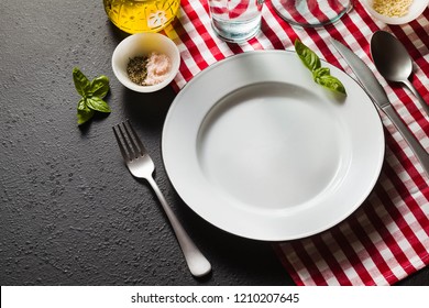 empty plates on a serving table in the Italian style. copy space