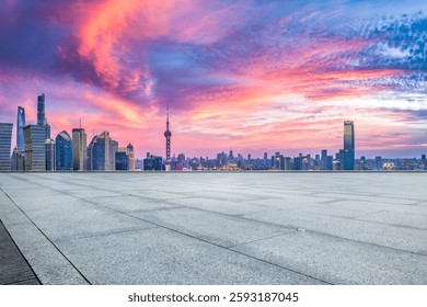 Empty platform with Shanghai skyline at dramatic sunset sky