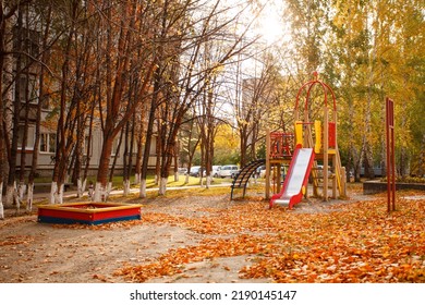 Empty Playground With A Beautiful Orange And Red Autumn Background. Selective Focus, Seasonal Banner For Site, Kindergarten, Daycare Outdoor Activity