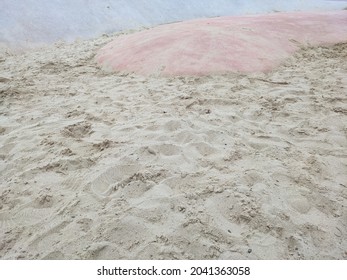 Empty playground islet with beige clean sand