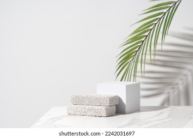 Empty podium for cosmetics beauty product presentation. Made with pumice stone on a bathroom table. Front view. - Shutterstock ID 2242031697