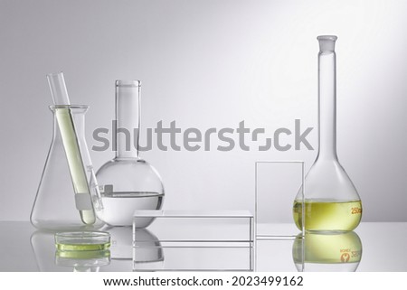 Empty podium glass for cosmetic bottle containers. Research and develop beauty skincare product concept with scientific glassware. Concept laboratory tests and research natural extract making cosmetic