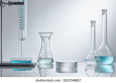 Empty podium glass with glass geometric platform. science laboratory test tubes, chemical laboratory equipment. Research and develop cosmetic in lab.  - Shutterstock ID 2023748837