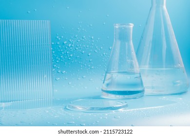 Empty podium with glass labware, flask bowl platform. Research and development of cosmetics in the laboratory.