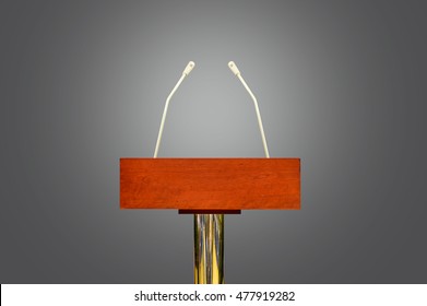 An empty podium and microphones isolated over gray background