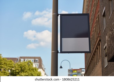 Empty Pole Sign As Pole Advertising Mock-up On Light Pole In The City