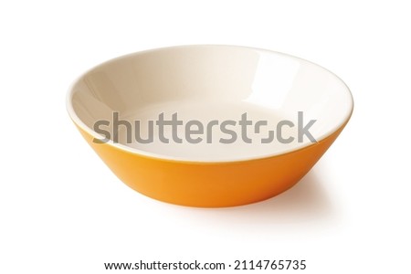 Empty porcelain bowl isolated on a white background. Orange beige ramekin close-up. Empty crockery for food design. Modern clay, ceramics or porcelain dishes and tableware. Front view.