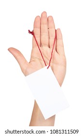 Empty price tag with red string in hand, isolated on white background.