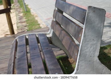 Empty Public Square Bench Made Of Wood And Concrete