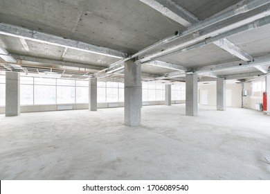 Empty Pure Commercial Office Building Undecorated In Gray Colors.open Space Office