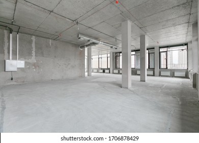 Empty Pure Commercial Office Building Undecorated In Gray Colors.open Space Office