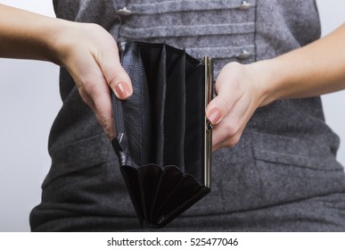 Empty Purse In Women's Hands