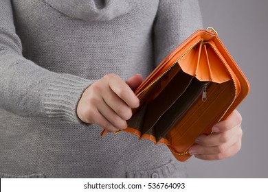 Empty Purse In Women's Hands