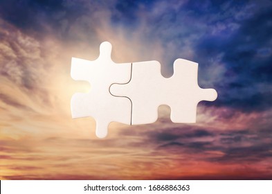 Empty puzzle against a dramatic sky