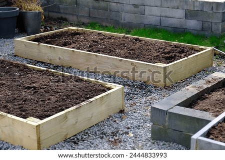Similar – Image, Stock Photo Allotment garden with summer flowers and vegetable patch behind wire fence