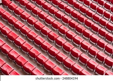 Empty Ranges Of Red Seats In A Stadium, Abstract Aerial View From Above