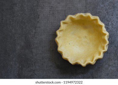 An Empty Raw Uncooked Pie Crust Before Baking With Copy Space, Top View