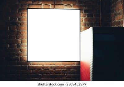 Empty rectangular advertising panel hanging on red brick wall with cement while black frame billboard put up for marketing campaign promotions in white color