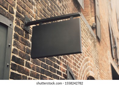 Empty rectangular black stopper on building. Bar or restaurant ad concept. Mock up