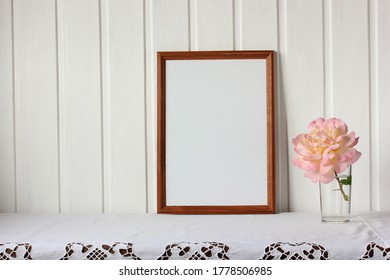 Empty Rectangular Frame And A Rose Flower On The Table. Mockup, Scene Creator.